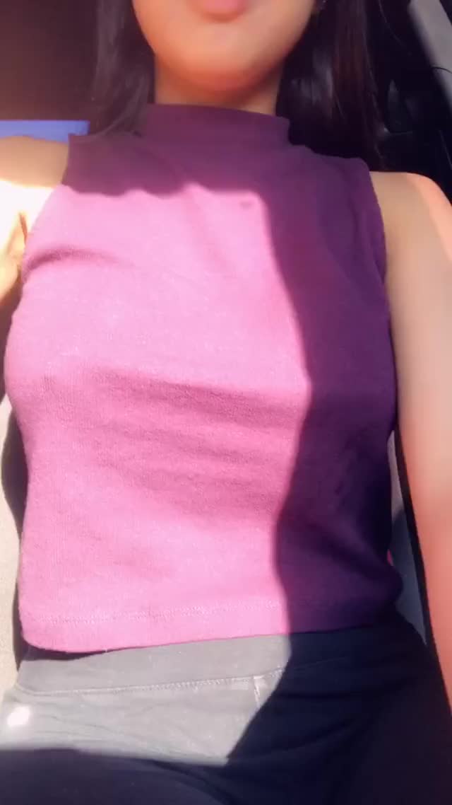 Showing off tits in the car