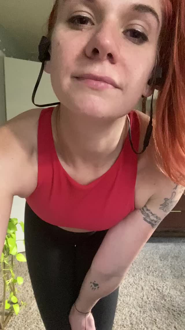 Sweaty redhead strips off gym clothes