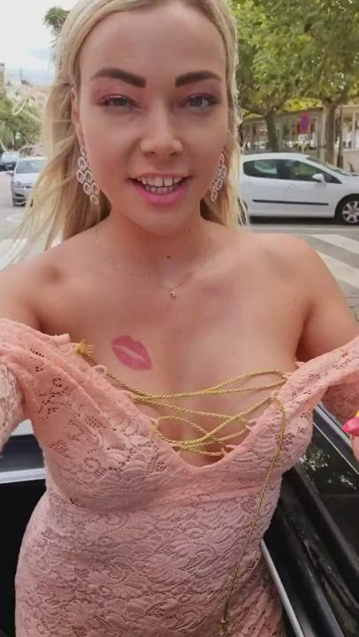 Showing her assets on a moving car