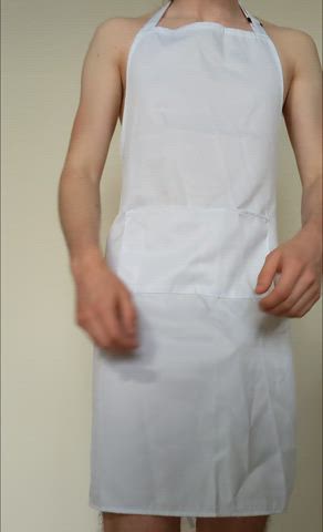 Wearing an apron and nothing else