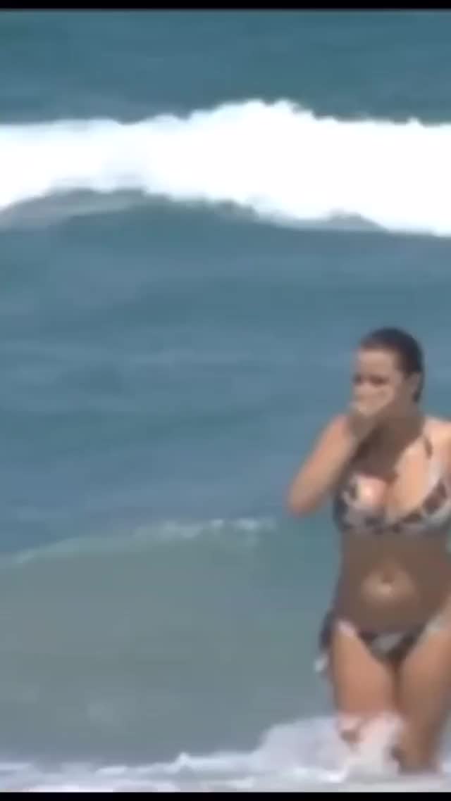 Big Jiggly boobs in bikini coming back from a swim