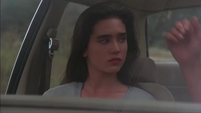 Jennifer Connelly - The Hot Spot (1990) - short clip in car, having head pulled close