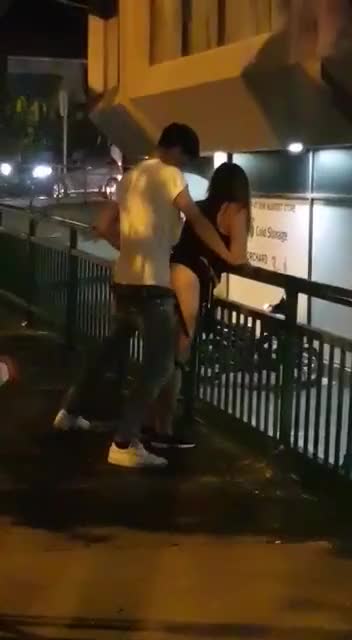 Couple fucking next to a building
