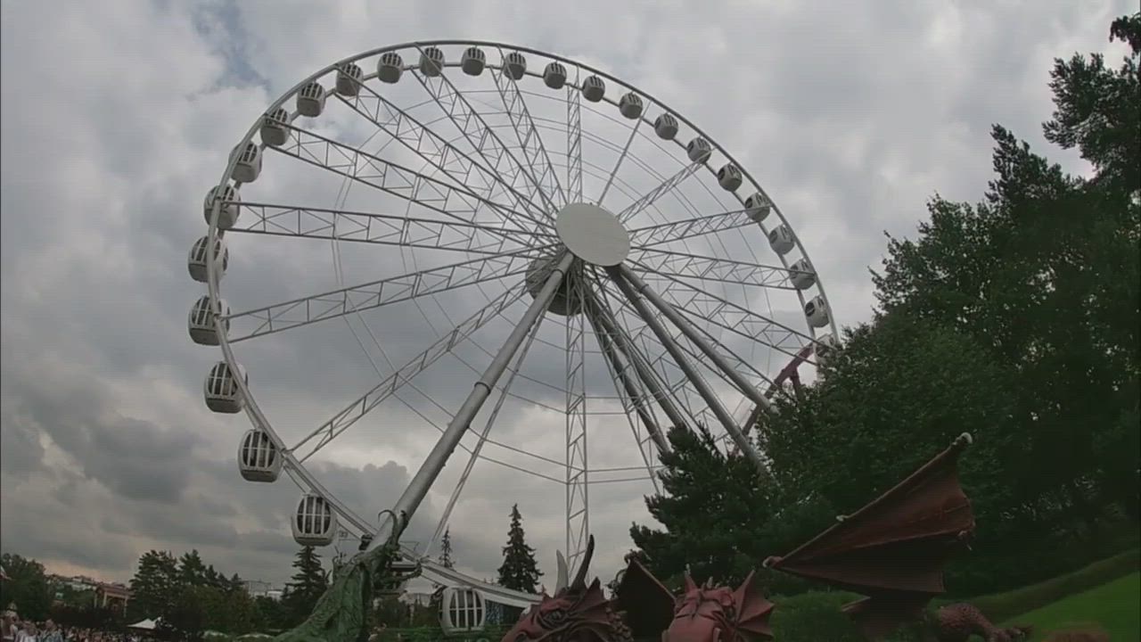 Beautiful girls give blowjob on the Ferris wheel