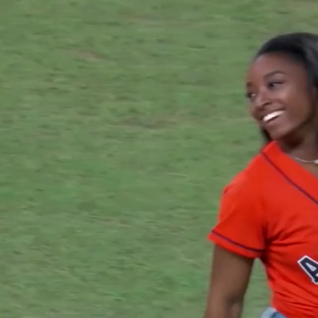 Simone Biles throws first pitch