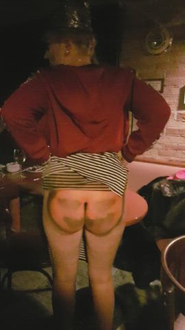 In a bar, flashing my bare bottom with my Halloween Costume!