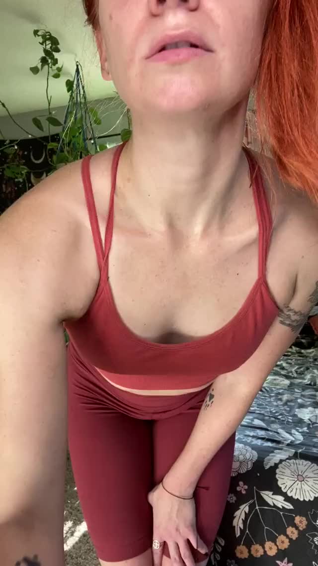Sweaty redhead wiggles out of workout clothes