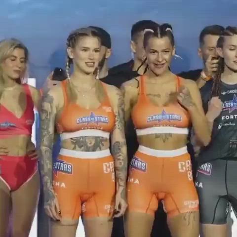 Tattooed models flashing at celebrity MMA weigh-in