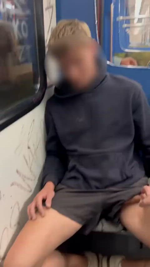 Horny twink gets a handjob on a public train and shoots all over himself