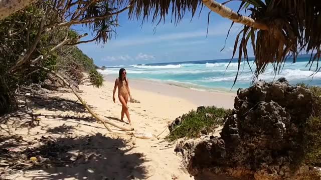 Nude banana masturbation on a beach