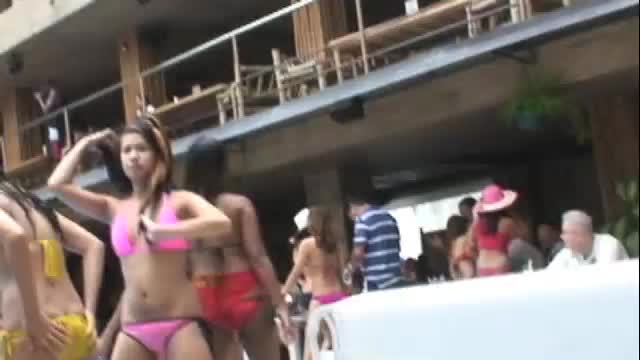 Asian girls in bikini at pool party