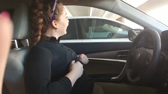 Playing with her tits in some parking lot