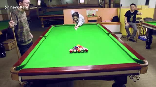 Talented Woman Clears The Pool Table With One Strike