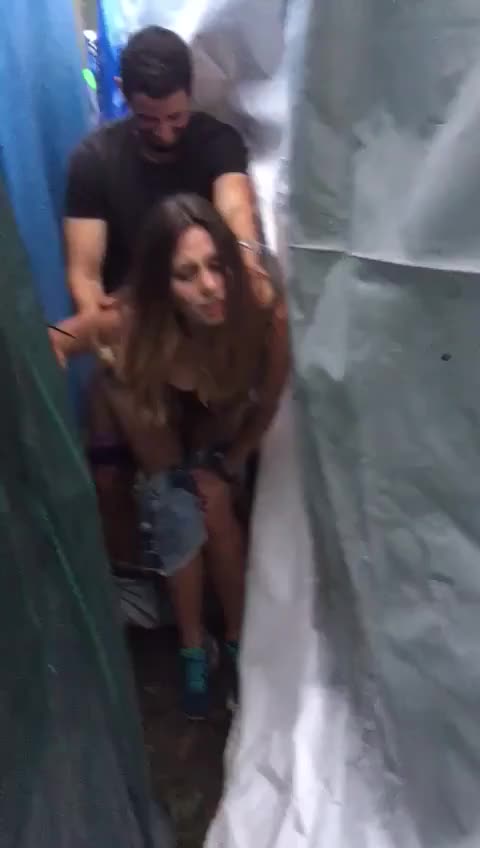 Couple caught fucking outside between two tents mid doggystyle [Gif]
