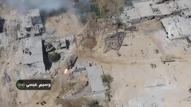 Opposition forces scatter as the SAA use a UR-77 mine clearer in Damascus