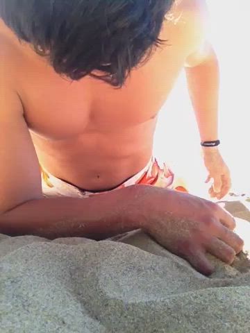 Surfer dude discretely cums on the beach