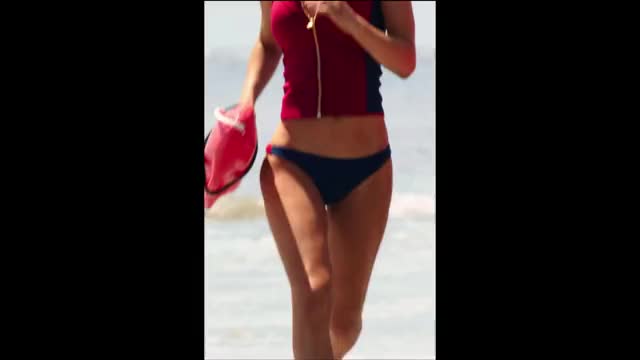 Alexandra Daddario - Baywatch - centered, black-barred edit of running on beach in