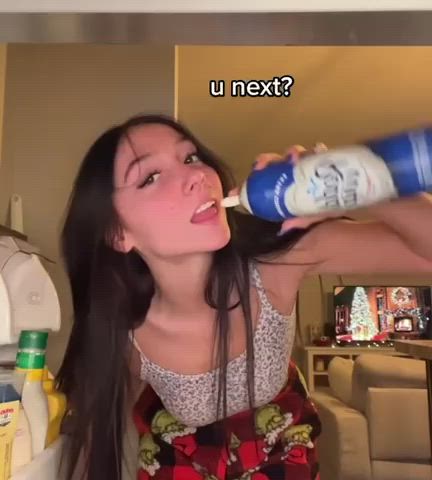 Cute teen licking up whipped cream