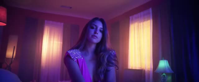 pink outfit in SEX music video