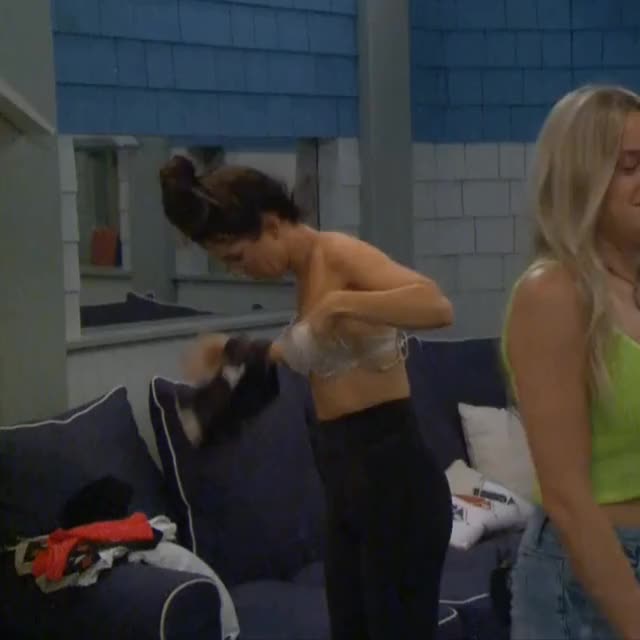 Holly readjusting her bra changing in the bathroom
