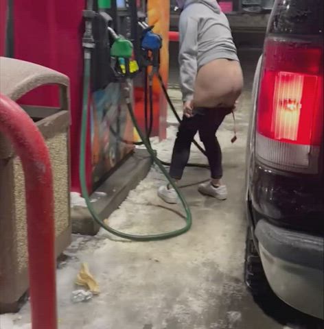 Desperate MILF pees in public at the gas pump