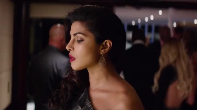Priyanka Chopra - Baywatch - in black sash-dress, at climactic party at end of film