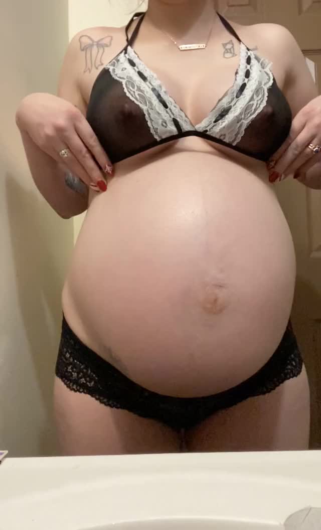 Showing off my full belly and tits