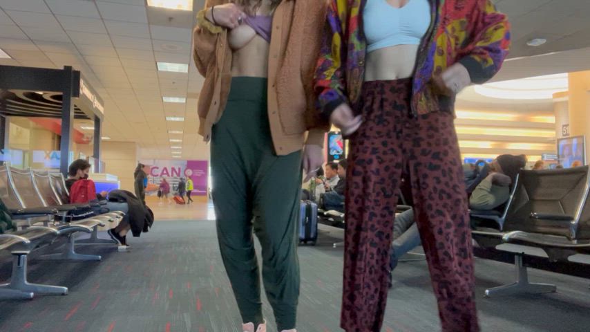 Flashing you our tits while we wait to board our flight