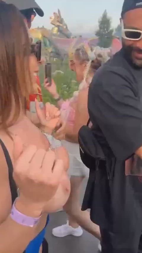 Flashing their big boobs at the music festival