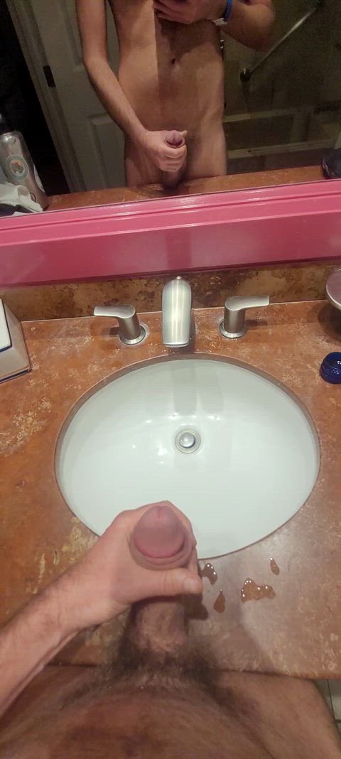 Hard pissing in a hotel barhroom