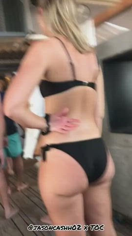 Thick cute sexy ass on blonde in black bikini standing in line