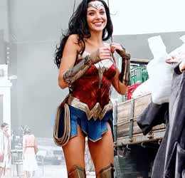 Gal Gadot enjoying wire work as it lets the crew look up her skirt easily...