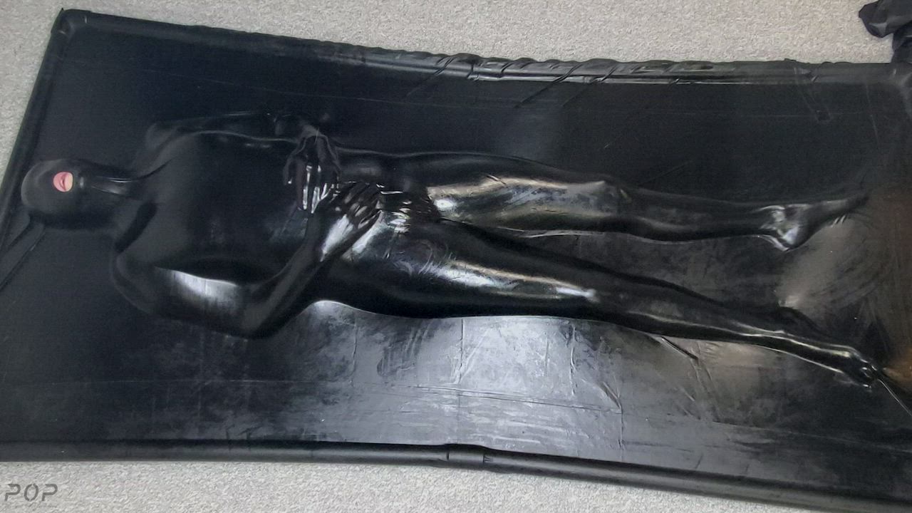 Struggling inside my latex vacbed [OC]