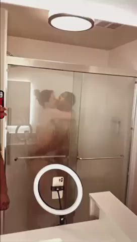 Kissing black bull in the shower