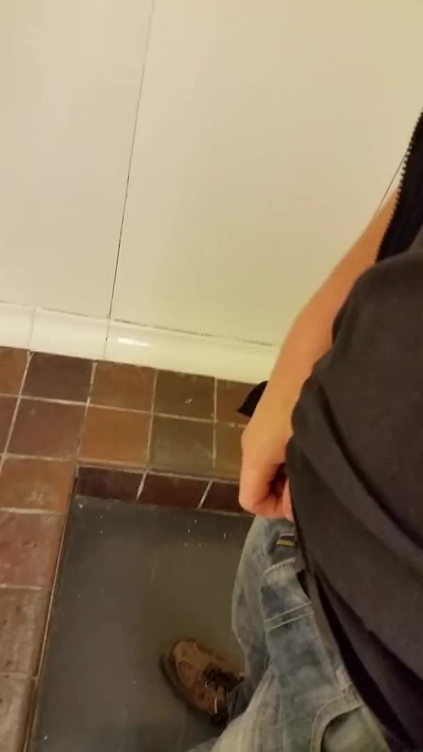 Pissing at the urinal