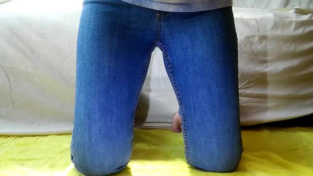Peeing in her jeans on her knees