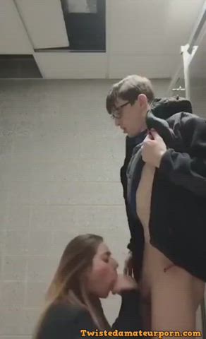 College girl gives nerdy costudent a blowjob in the bathroom stalls