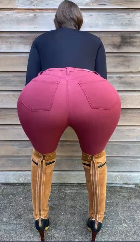 Slapping her tight jeans ass 