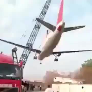 Crane lifting a massive airliner fails