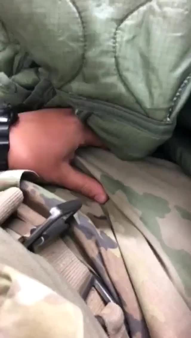 Brave soldier plays with his gun with tons of guys everywhere