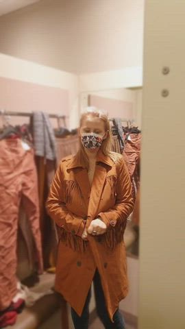 You see a girl in a coat in a changing room in a store and suddenly.... Tadam!