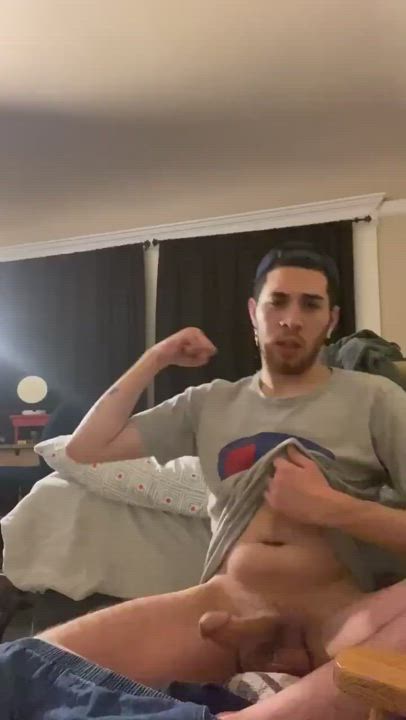 Flexing and showing his big cock and balls