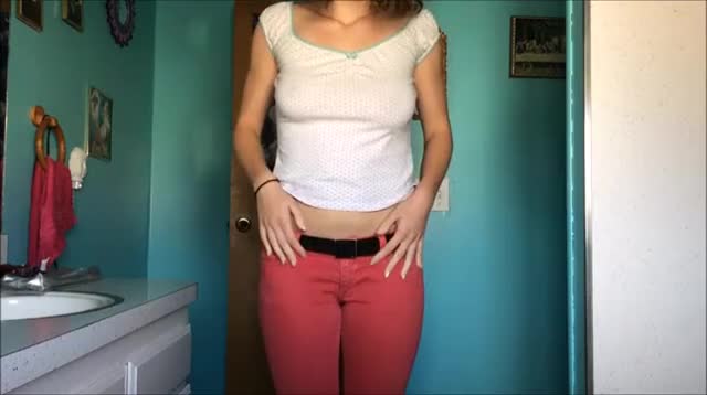 Wetting her pink jeans