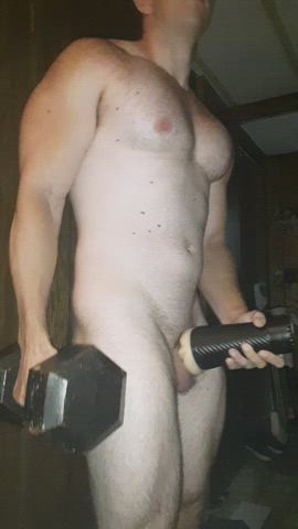 Curling a 45 lb dumbbell and using a fleshlight with other hand