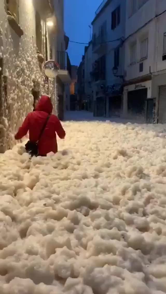 ? Sea foam fills the streets of Spain after a storm hits the country