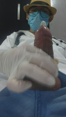 Doctor filling a condom