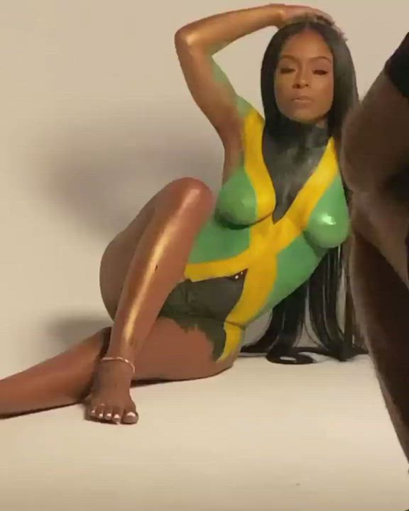Jamaican model with her country's flag painted on her