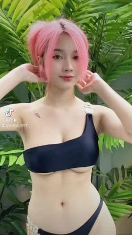 Asian girl with pink hair on tiktok