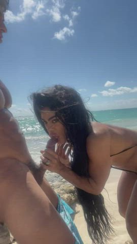 Liking the pre cum out on the beach