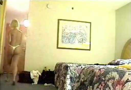 Topless girl opens the door to a room service woman